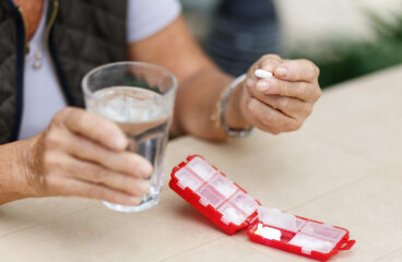 Head Shot Portrait Happy Woman Holds Pill Glass Of Water, Takes